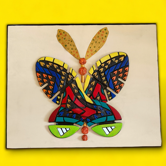 Recycled wall art made of painted shoe soles in the shape of a Butterfly